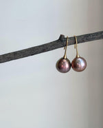 Genuine Edison pearl earrings with distinctive rose, gold and green overtones and extreme mirror luster.