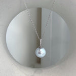 Close-up of 11.6mm Edison pearl showing elegant white silver color and extreme mirror-like shine.