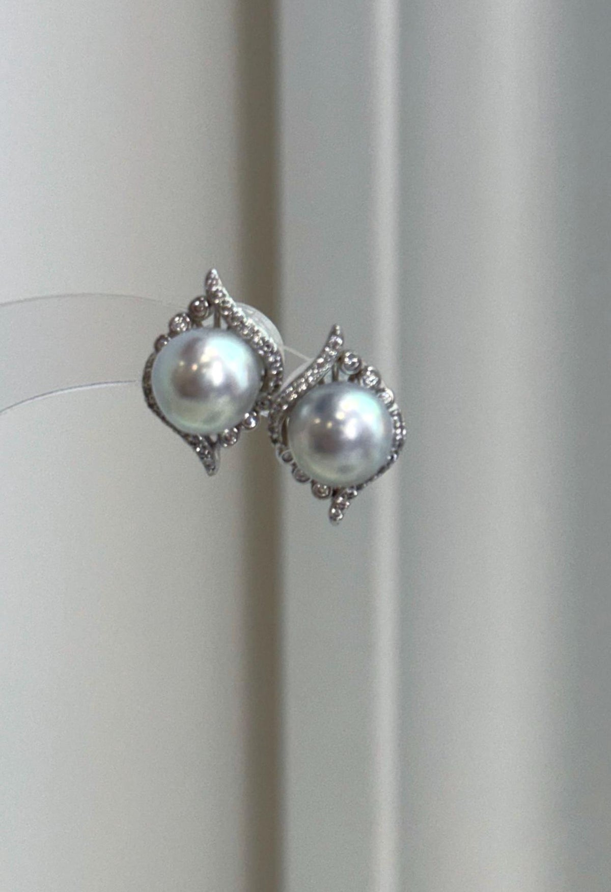 Genuine ocean blue Akoya saltwater pearl earrings with cool silver overtones and luminous mirror luster.