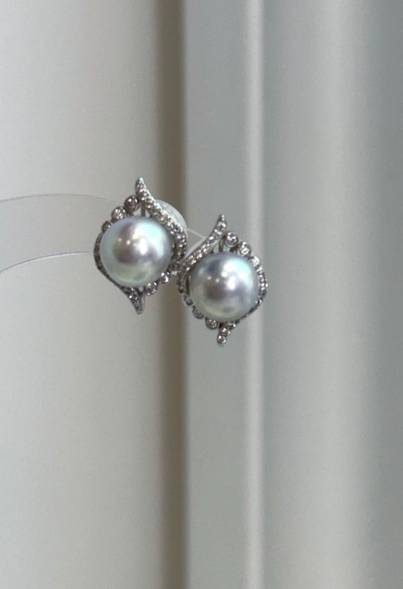Genuine ocean blue Akoya saltwater pearl earrings with cool silver overtones and luminous mirror luster.
