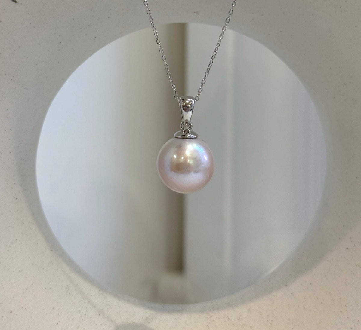 Genuine Edison freshwater pearl pendant in a soft light rose color with high reflective luster
