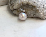 Minimalist Edison pearl necklace pendant with a huge round light rose pearl and sterling silver setting