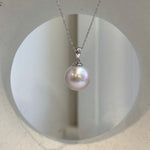 Light rose Edison pearl jewelry featuring a large lustrous pearl with elegant minimalist silver design
