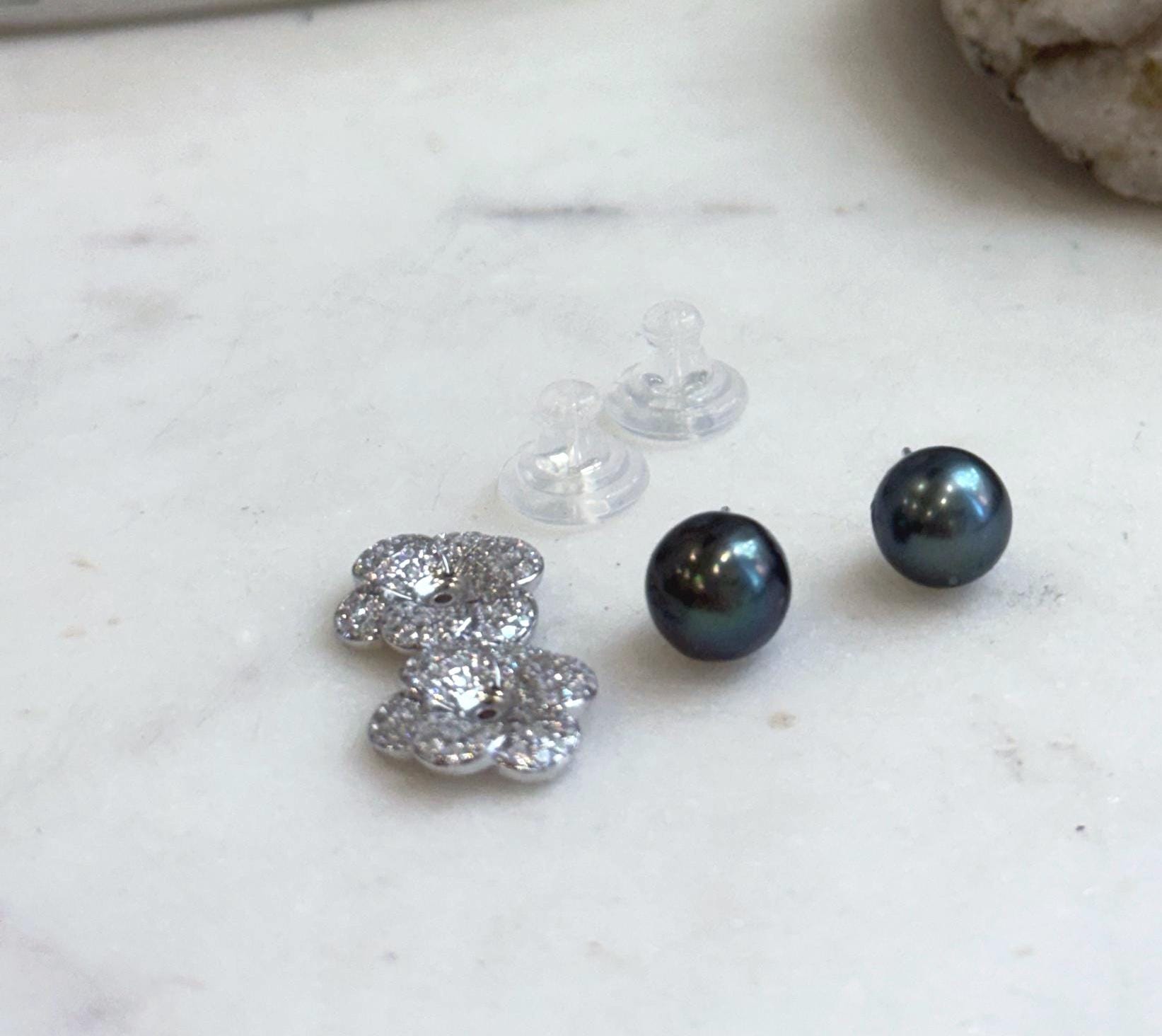 Elegant Tahitian pearl stud earrings with dark hunter green tones and removable sterling silver floral earring jackets.