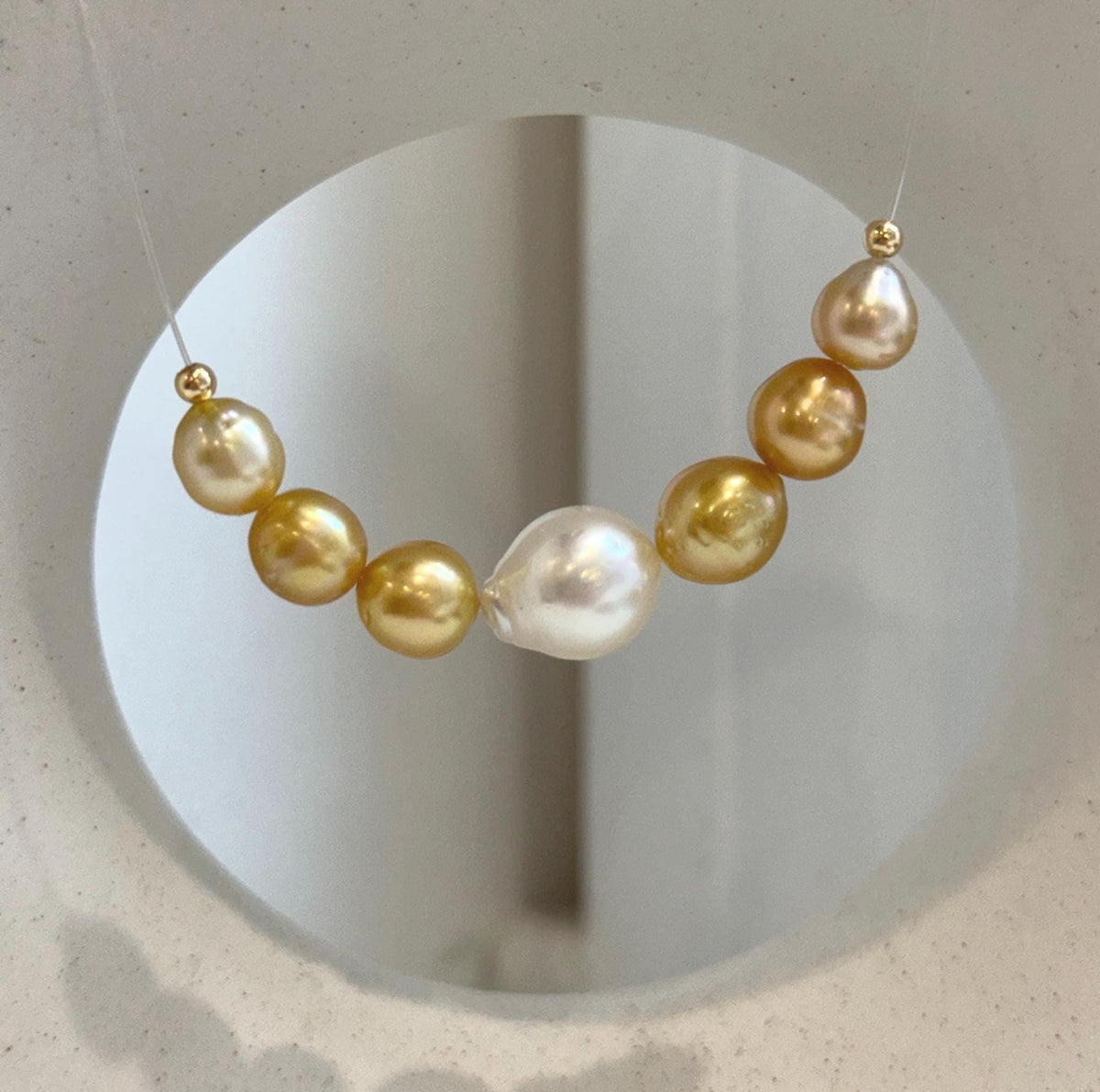 South Sea pearl smile necklace with 7 graduated genuine saltwater pearls and elegant minimalist design