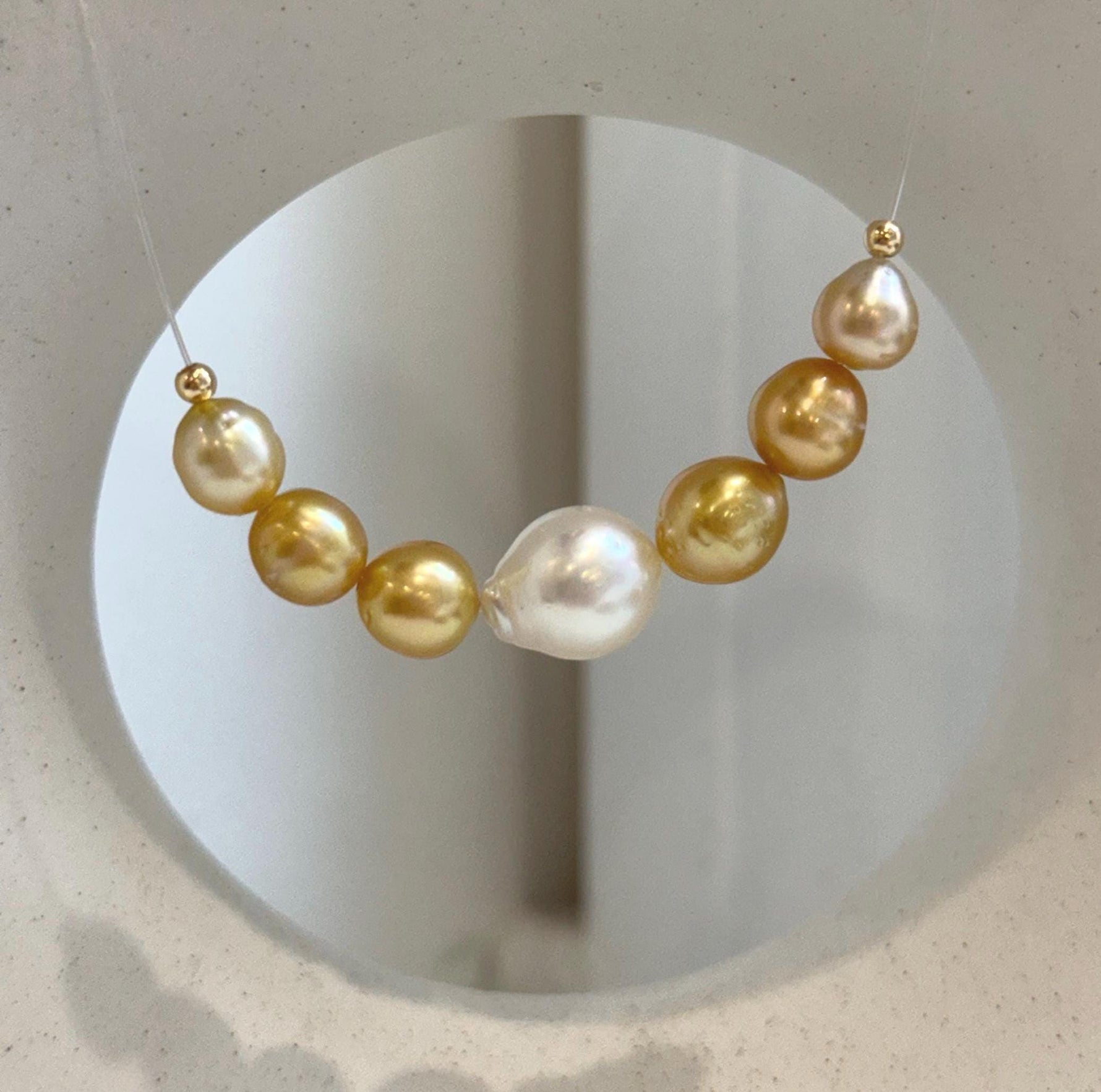 South Sea pearl smile necklace with 7 graduated genuine saltwater pearls and elegant minimalist design