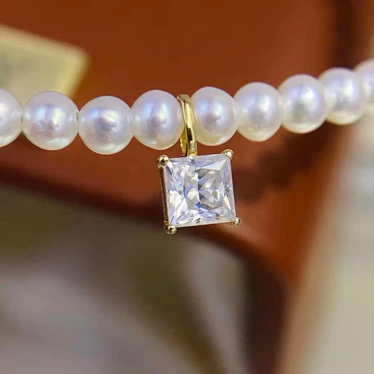 Princess cut square moissanite charm set in solid Au750 18K yellow gold with brilliant clear sparkle.