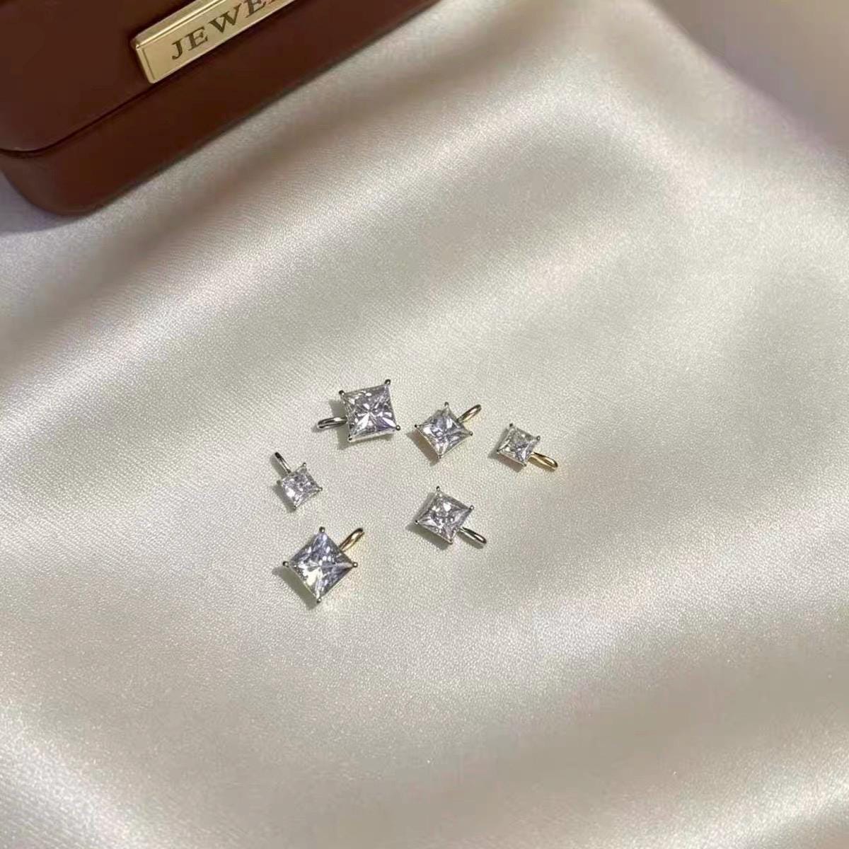 Sparkling princess cut moissanite charm crafted with genuine Au750 solid 18K yellow gold.