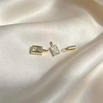 Brilliant rectangular moissanite jewelry charm featuring an elegant emerald cut and Au750 18K gold.