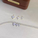 Clear heart cut moissanite charm featuring brilliant sparkle and a delicate Au750 18K gold setting.