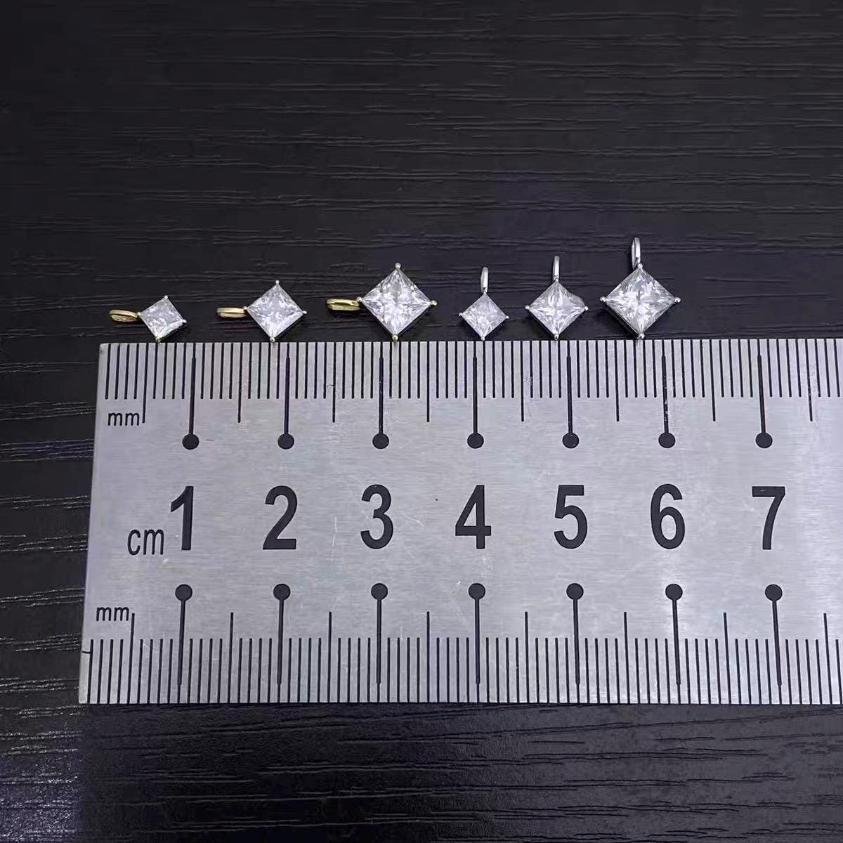 Dainty Au750 solid 18K gold moissanite charms available in small, medium and large sizes.
