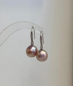 Genuine freshwater Edison pearl earrings featuring 12.2mm pink gold pearls with beautiful mirror-like luster.