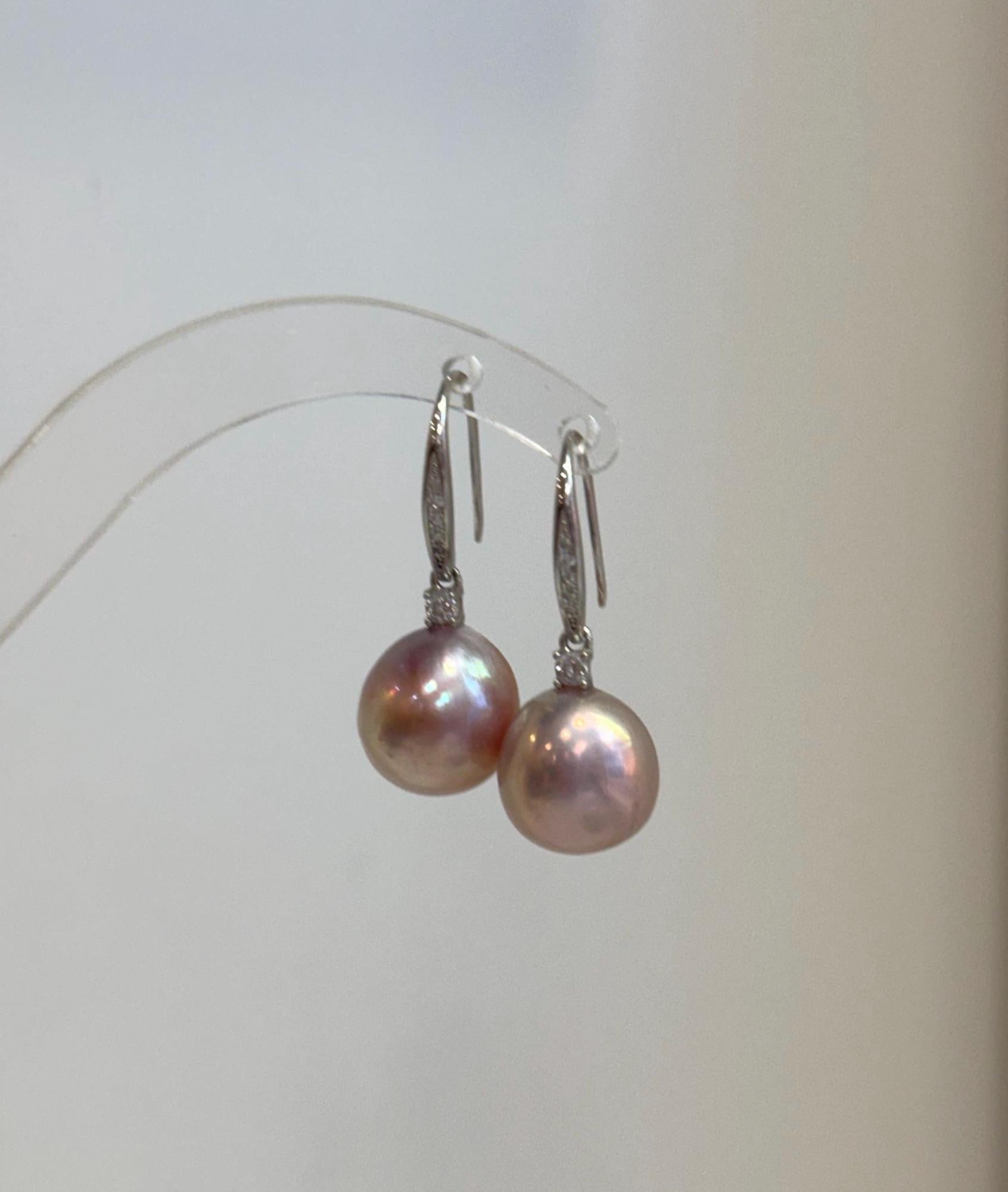 Genuine freshwater Edison pearl earrings featuring 12.2mm pink gold pearls with beautiful mirror-like luster.