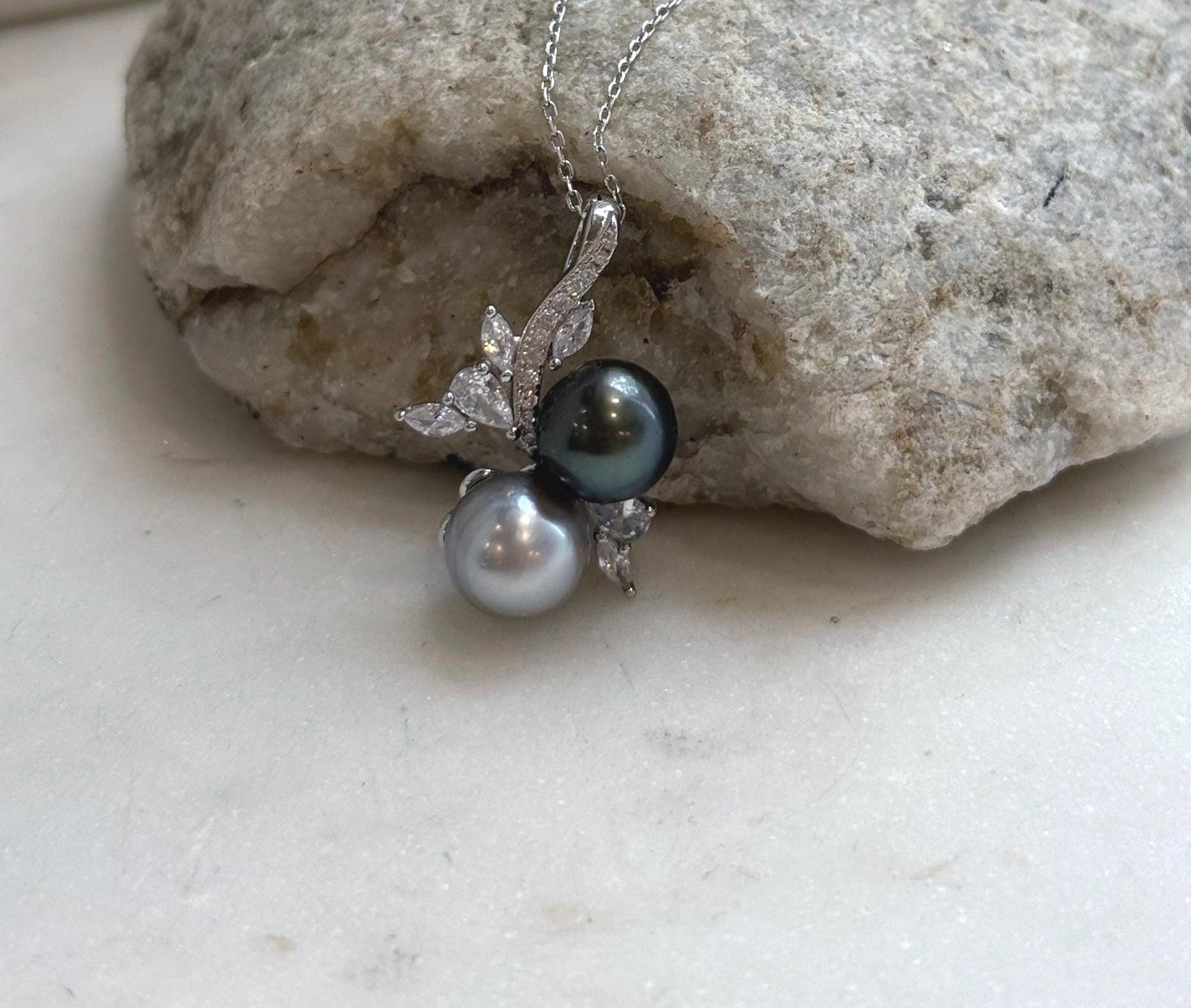 Genuine Tahitian saltwater pearl pendant with two 9.2–9.5mm pearls displaying rich natural color and bright mirror luster.