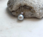 Large Tahitian pearl necklace pendant with an 11.9mm ocean pearl and elegant sterling silver setting.