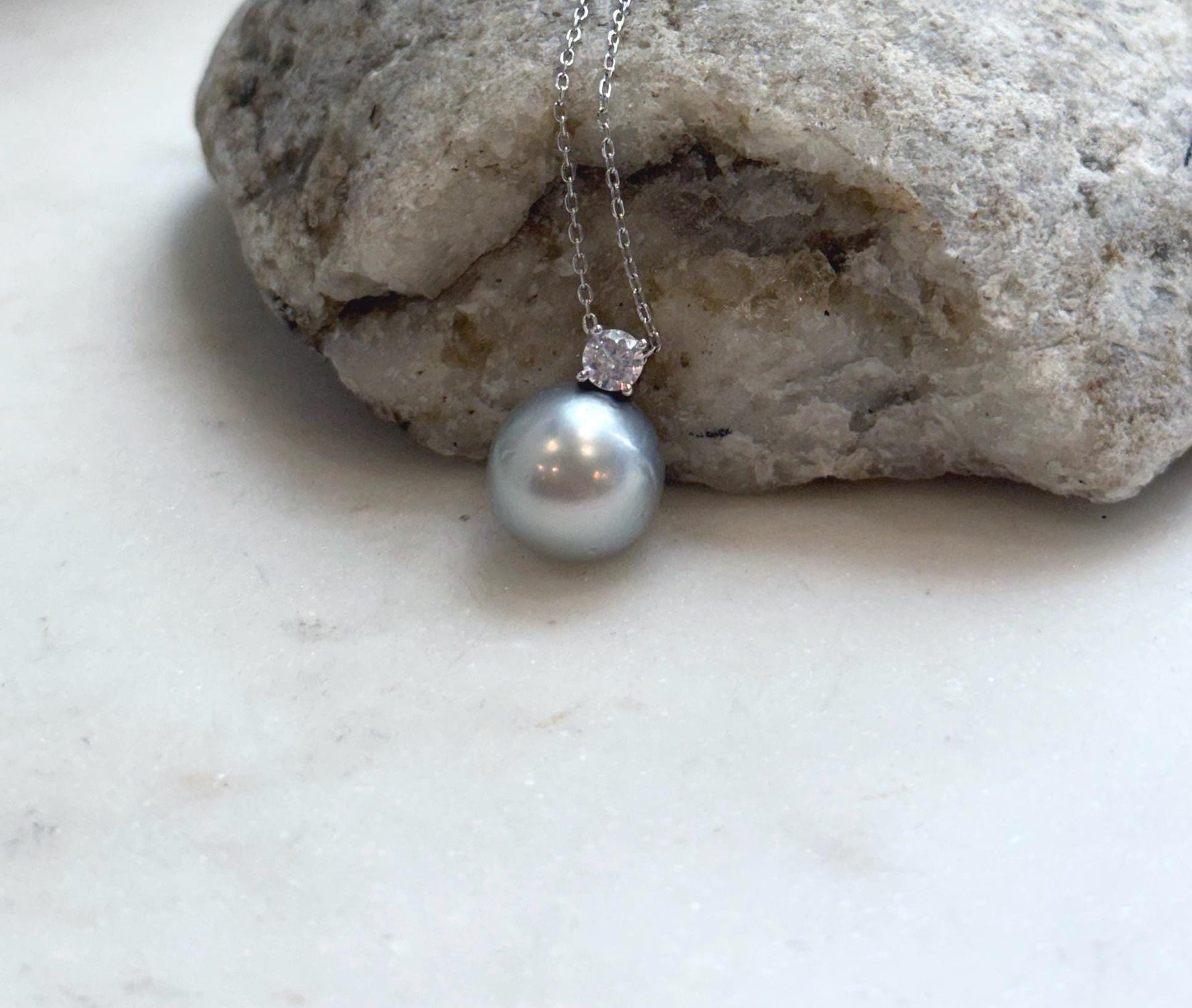 Large Tahitian pearl necklace pendant with an 11.9mm ocean pearl and elegant sterling silver setting.