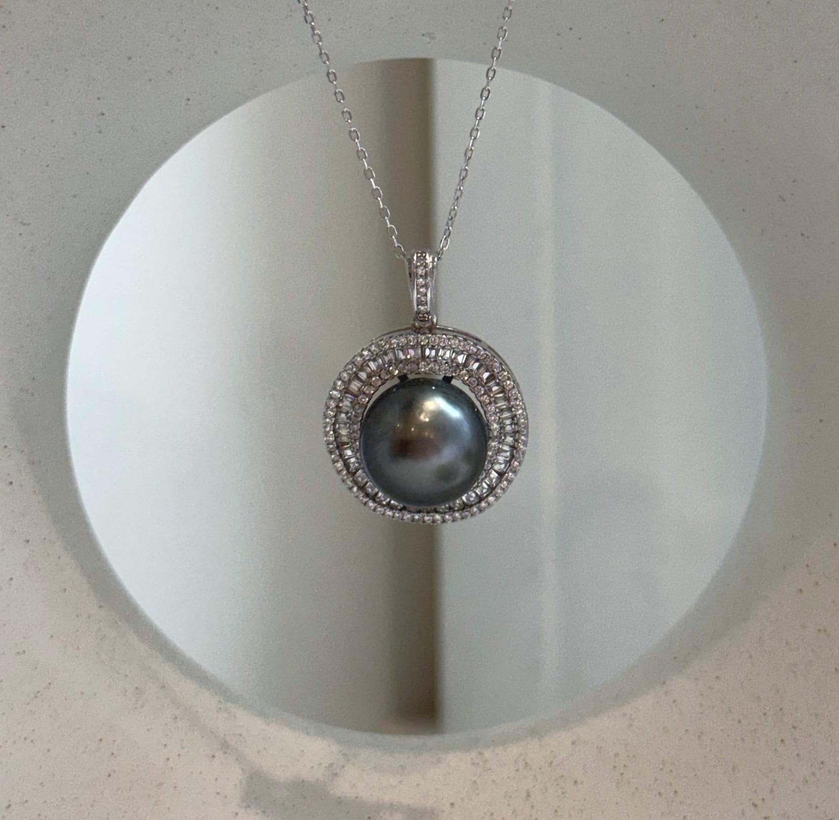 Genuine Tahitian ocean pearl pendant necklace with a large 13mm lustrous pearl and sterling silver setting.