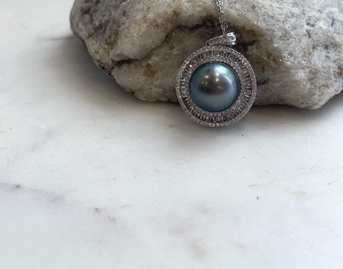 Close-up of 13mm Tahitian pearl pendant showing its strong mirror luster and natural ocean pearl surface.