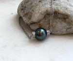 Large Tahitian saltwater pearl pendant necklace featuring a 12.7mm pearl and elegant vintage silver setting.