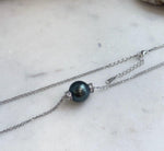 Elegant Tahitian ocean pearl pendant necklace featuring a lustrous 12.7mm pearl in a vintage silver setting.