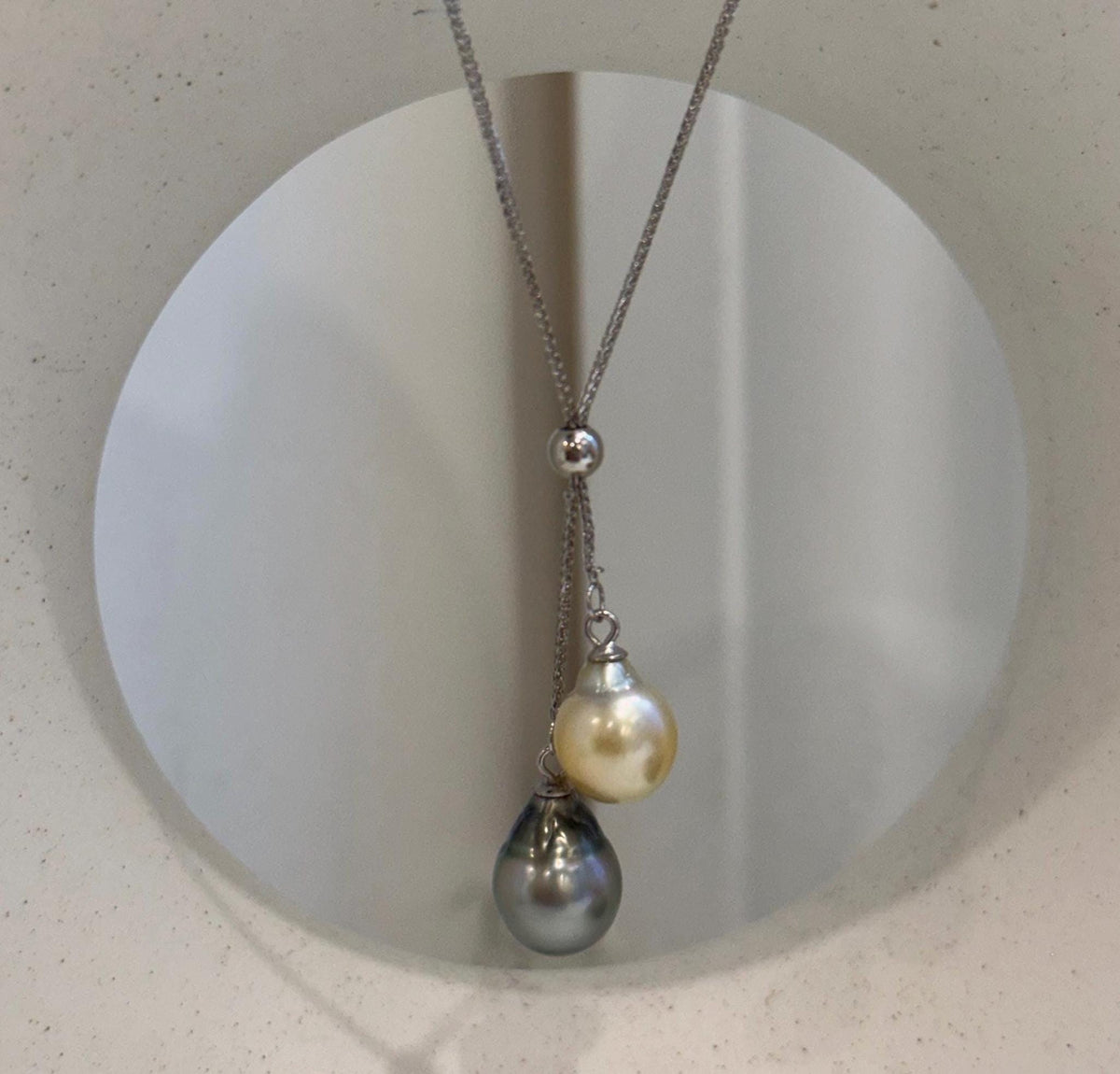 Luxury double pearl necklace featuring genuine golden South Sea and Tahitian pearls with brilliant mirror luster.