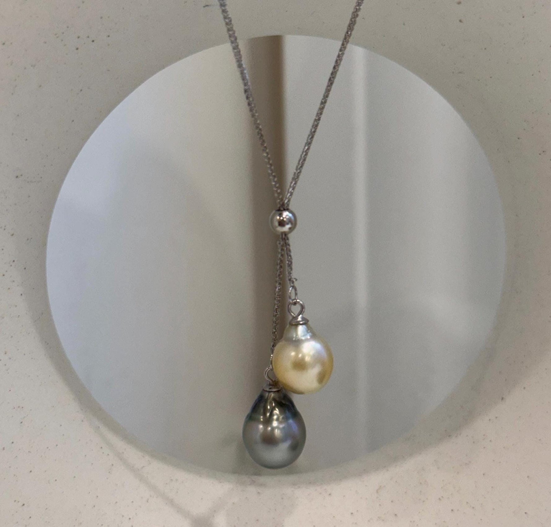 Luxury double pearl necklace featuring genuine golden South Sea and Tahitian pearls with brilliant mirror luster.
