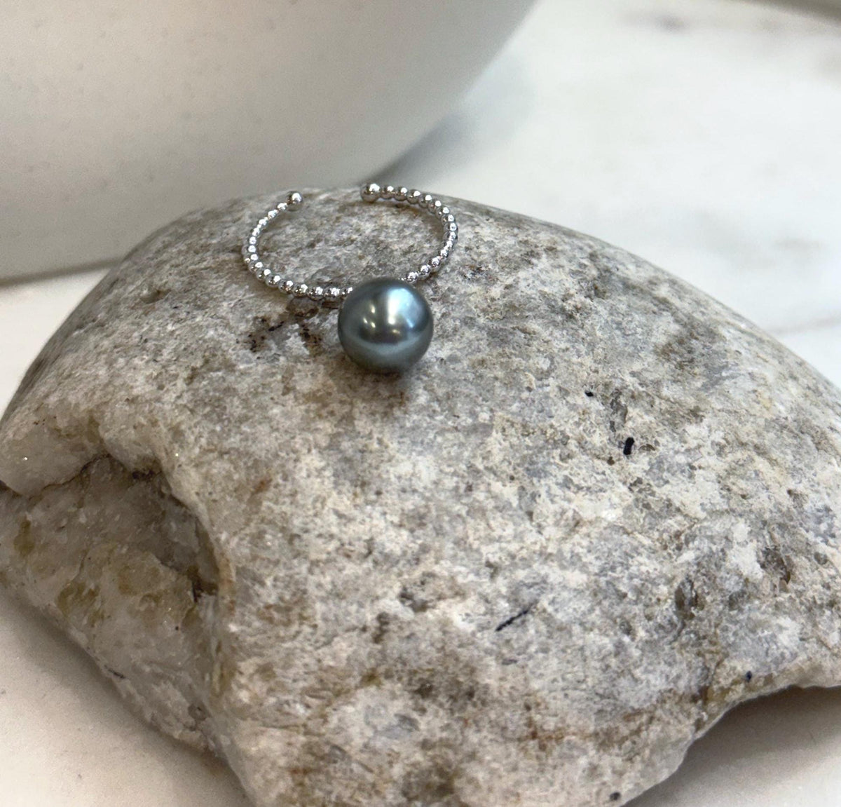 Genuine saltwater Tahitian pearl ring featuring a beautiful platinum tone and brilliant luster