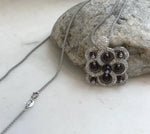 Genuine garnet jewelry featuring a beautiful natural deep red gemstone pendant