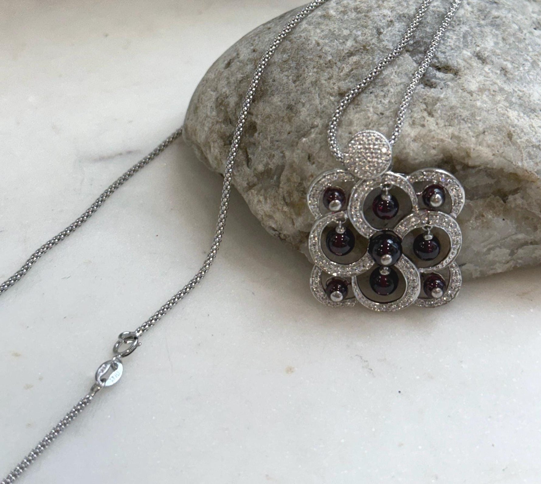 Genuine garnet jewelry featuring a beautiful natural deep red gemstone pendant