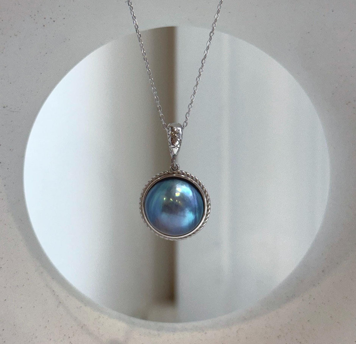 Blue iridescent ocean Mabe pearls set in elegant S925 sterling silver