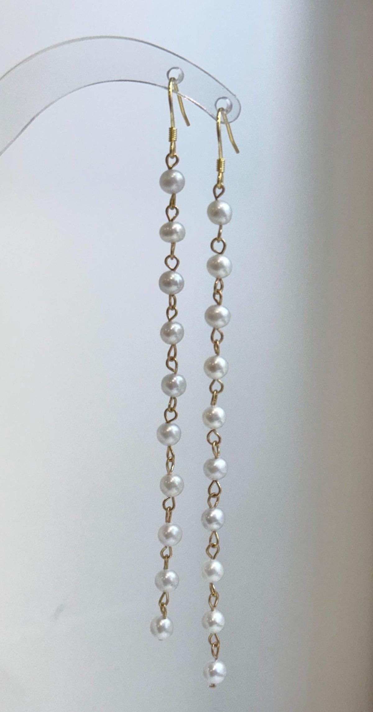 Elegant cascading freshwater pearl earrings with titanium steel findings and silver ear hooks
