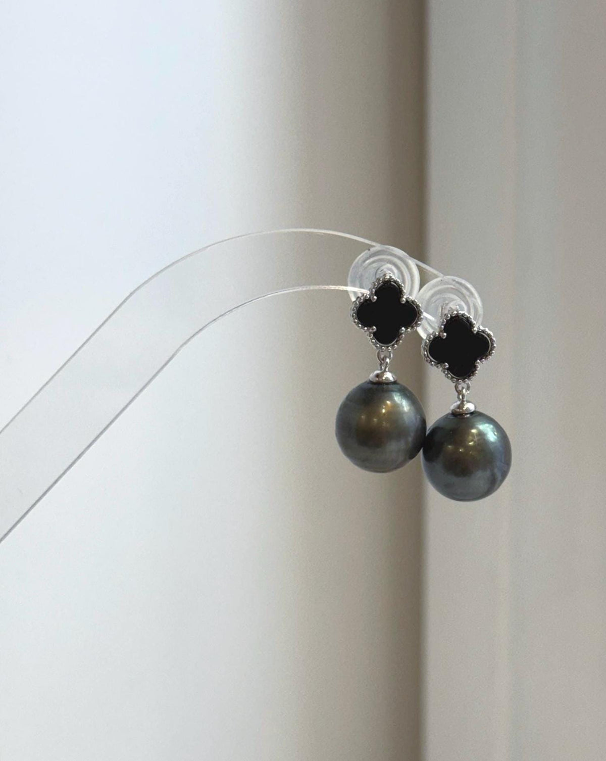 Tahitian platinum black pearl earrings with exceptional mirror luster