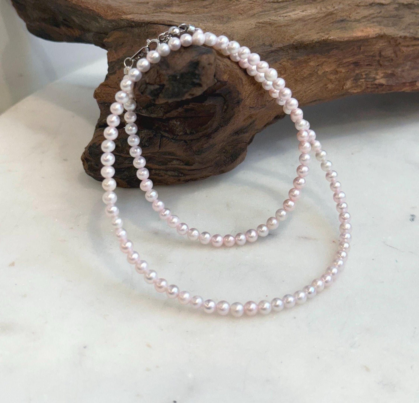 Pale pink freshwater pearl necklace with extreme mirror luster