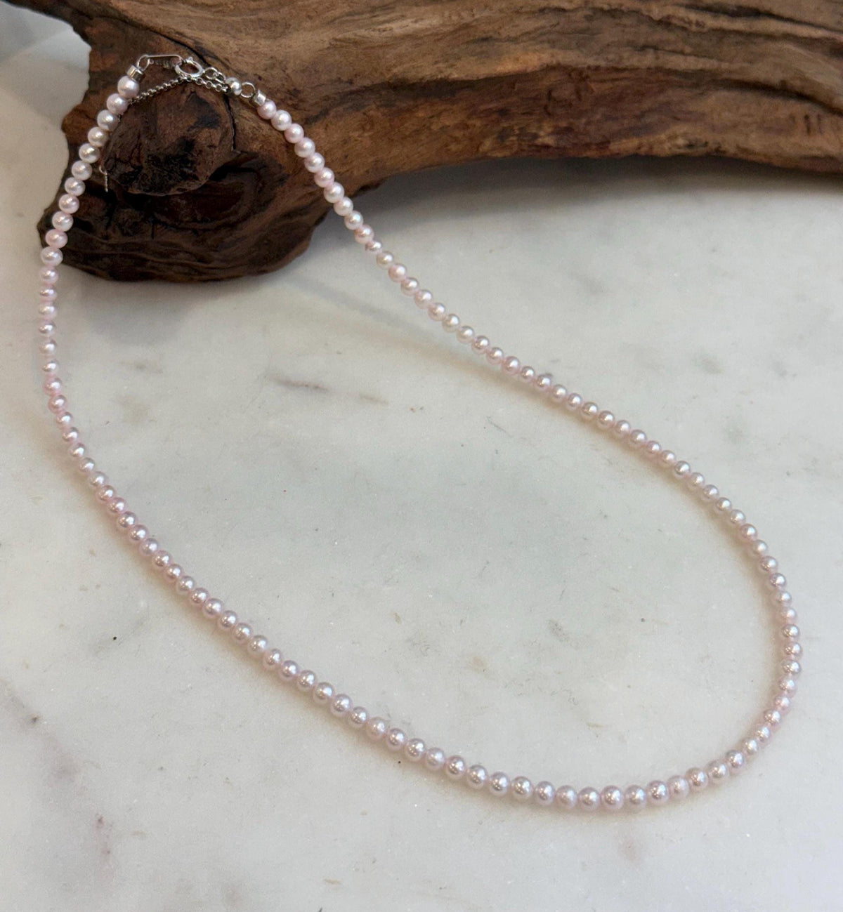 Elegant tiny pink pearl necklace with sterling silver clasp