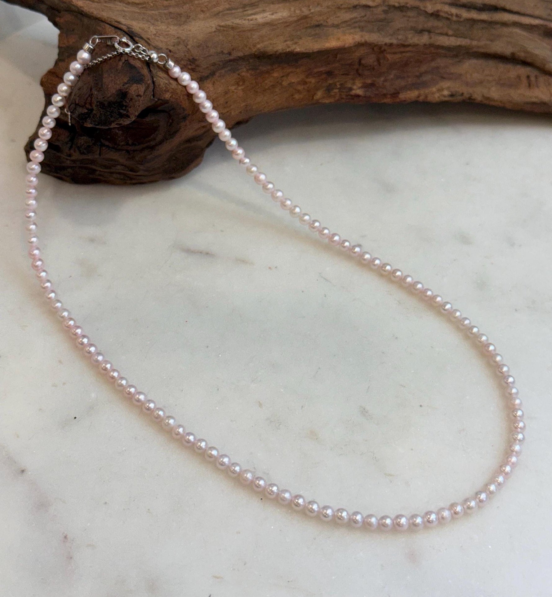 Elegant tiny pink pearl necklace with sterling silver clasp