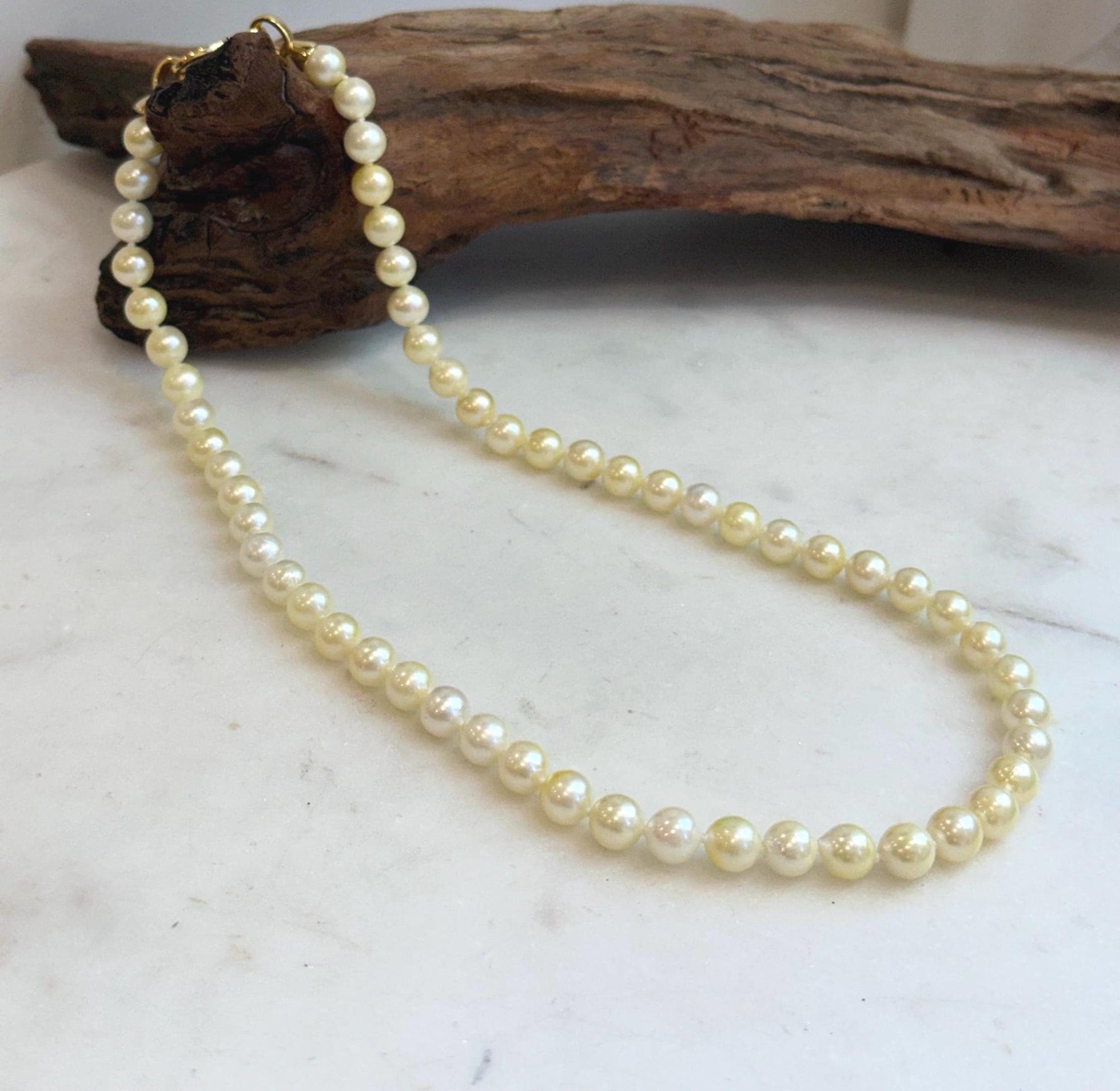 Genuine ocean pearl necklace featuring rich golden Akoya pearls