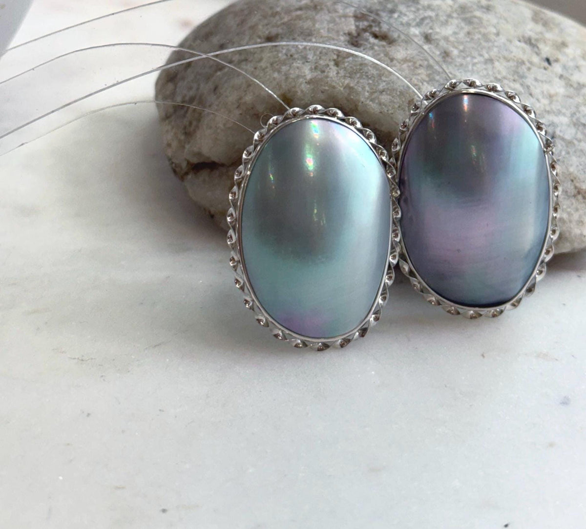 Elegant blue Mabe pearl earrings in sterling silver setting