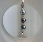 9.5–9.7mm Tahitian ocean pearls with extreme metallic mirror luster.