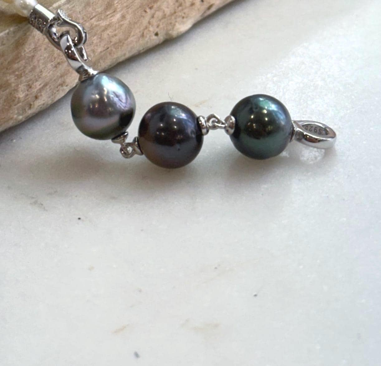 Genuine saltwater Tahitian pearl extender featuring three unique pearl colors.