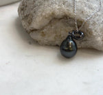 Tahitian black pearl pendant with deep hunter green iridescence