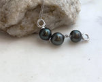 9.7–9.9mm Tahitian pearls with extreme metallic luster