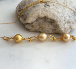 Genuine South Sea golden pearl necklace with three luminous saltwater pearls