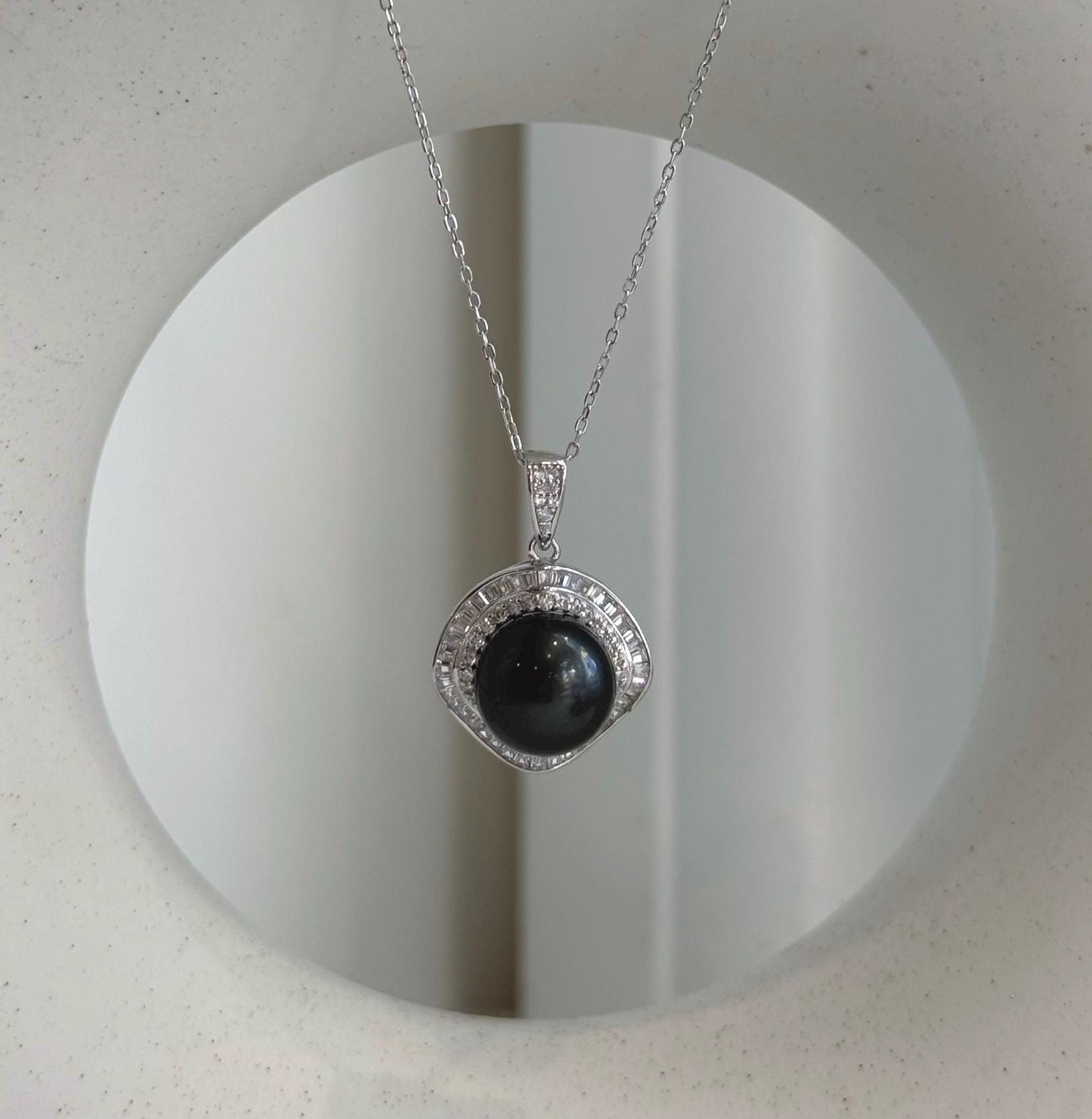 Black Tahitian pearl necklace pendant featuring rich natural overtones and high luster