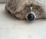 Elegant saltwater pearl pendant with dark Tahitian color and detailed silver setting