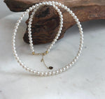 Top 5A white pearl necklace featuring luminous small pearls and an elegant 18K solid gold clasp.