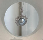 Rare oversized Tahitian pearl pendant chain set with natural silver color and intense reflective shine.