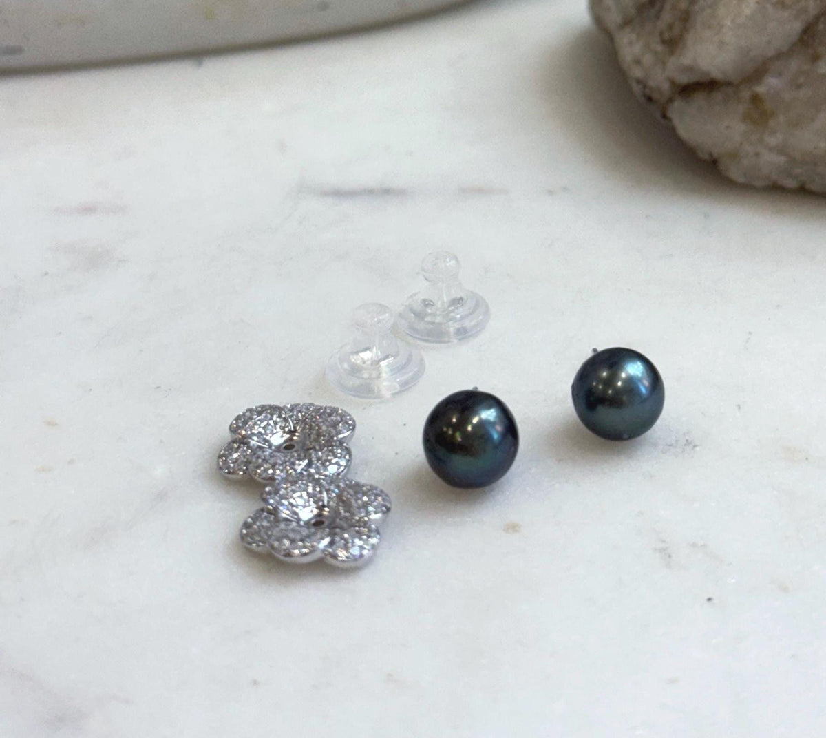 Natural Tahitian ocean pearl stud earrings paired with S925 sterling silver floral earring jackets for an elegant look.