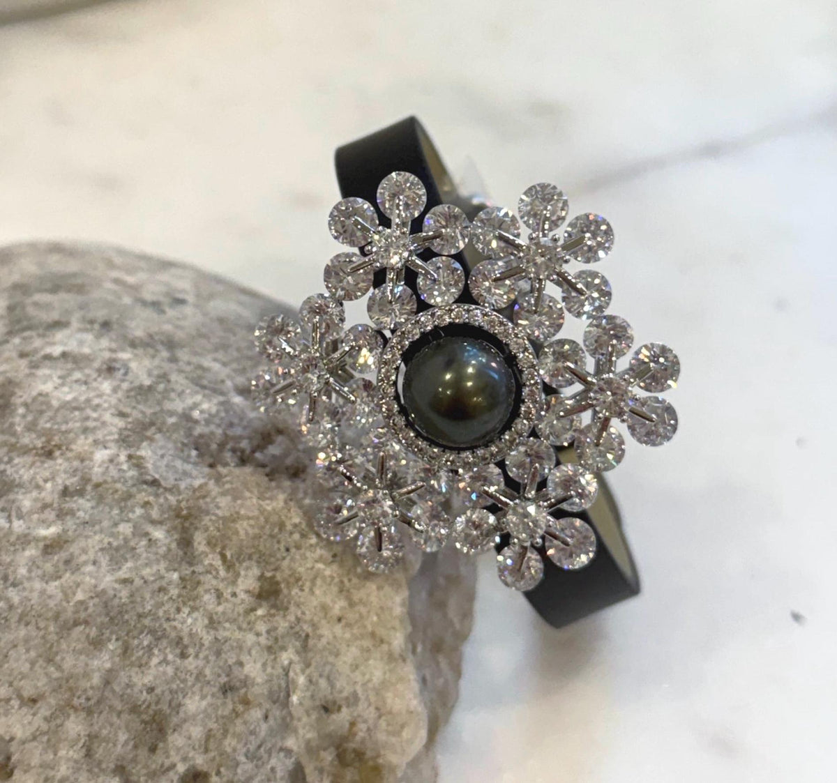 Platinum Tahitian ocean pearl leather strap bracelet with elegant snowflake design