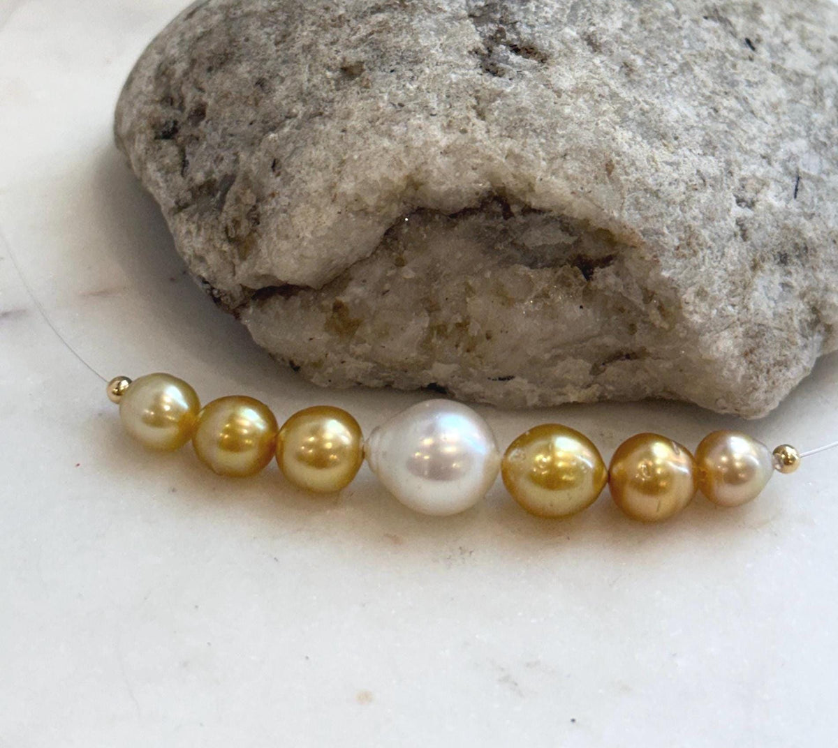 Elegant South Sea pearl smile necklace featuring 7 genuine ocean pearls on a delicate chain