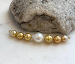 Graduated South Sea pearl necklace with 7 luminous saltwater pearls and feminine smile necklace style